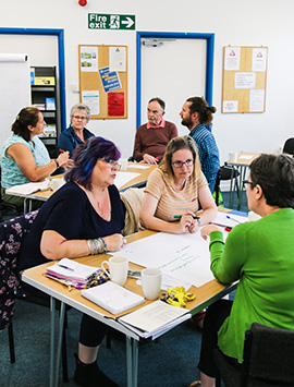 Members of one of GRCC's Network talking together at an event